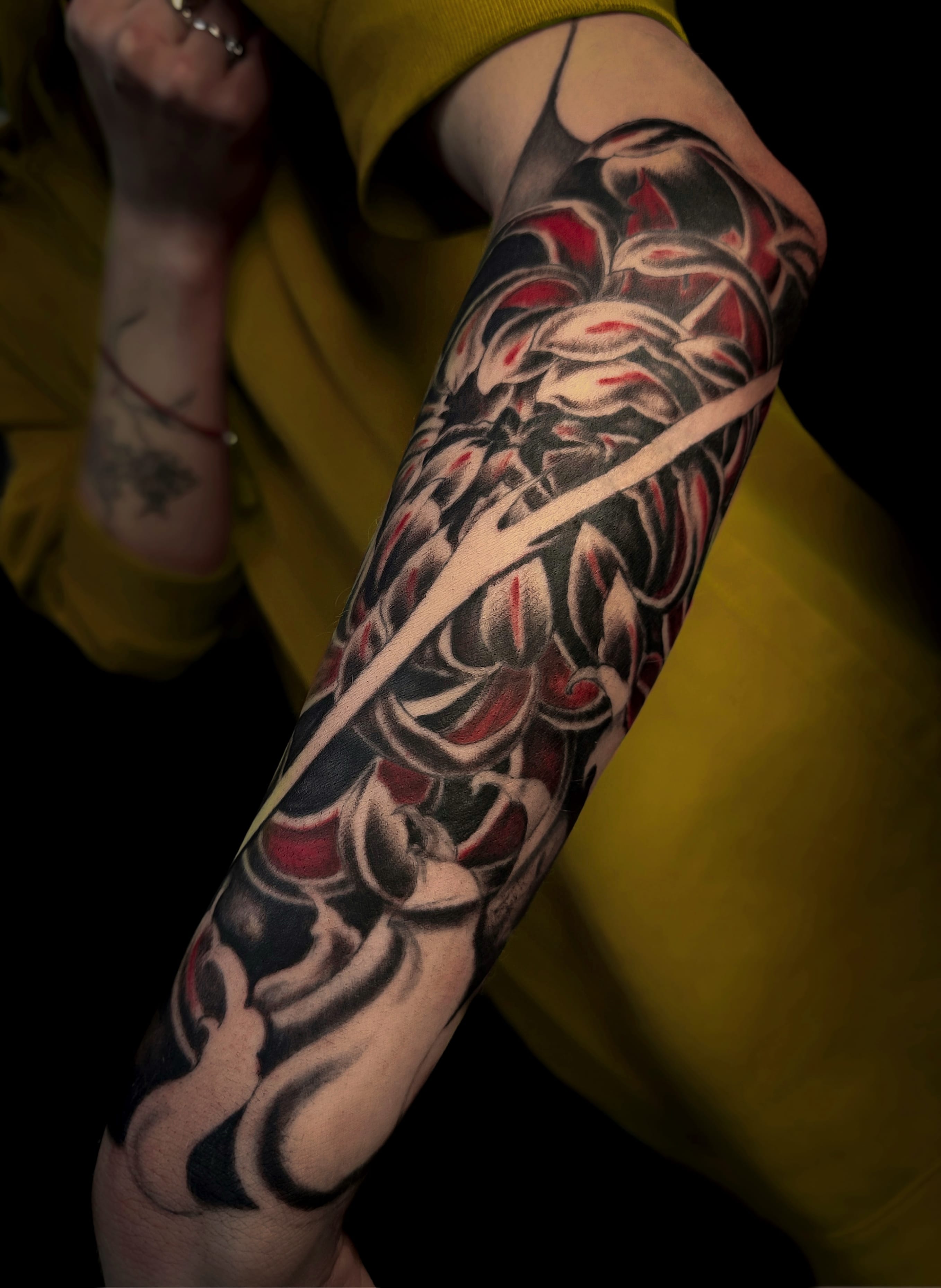 forearm black and red tattoo